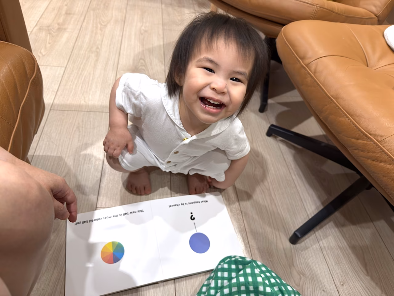 A big smile for a big idea — enjoying learning time on the floor.