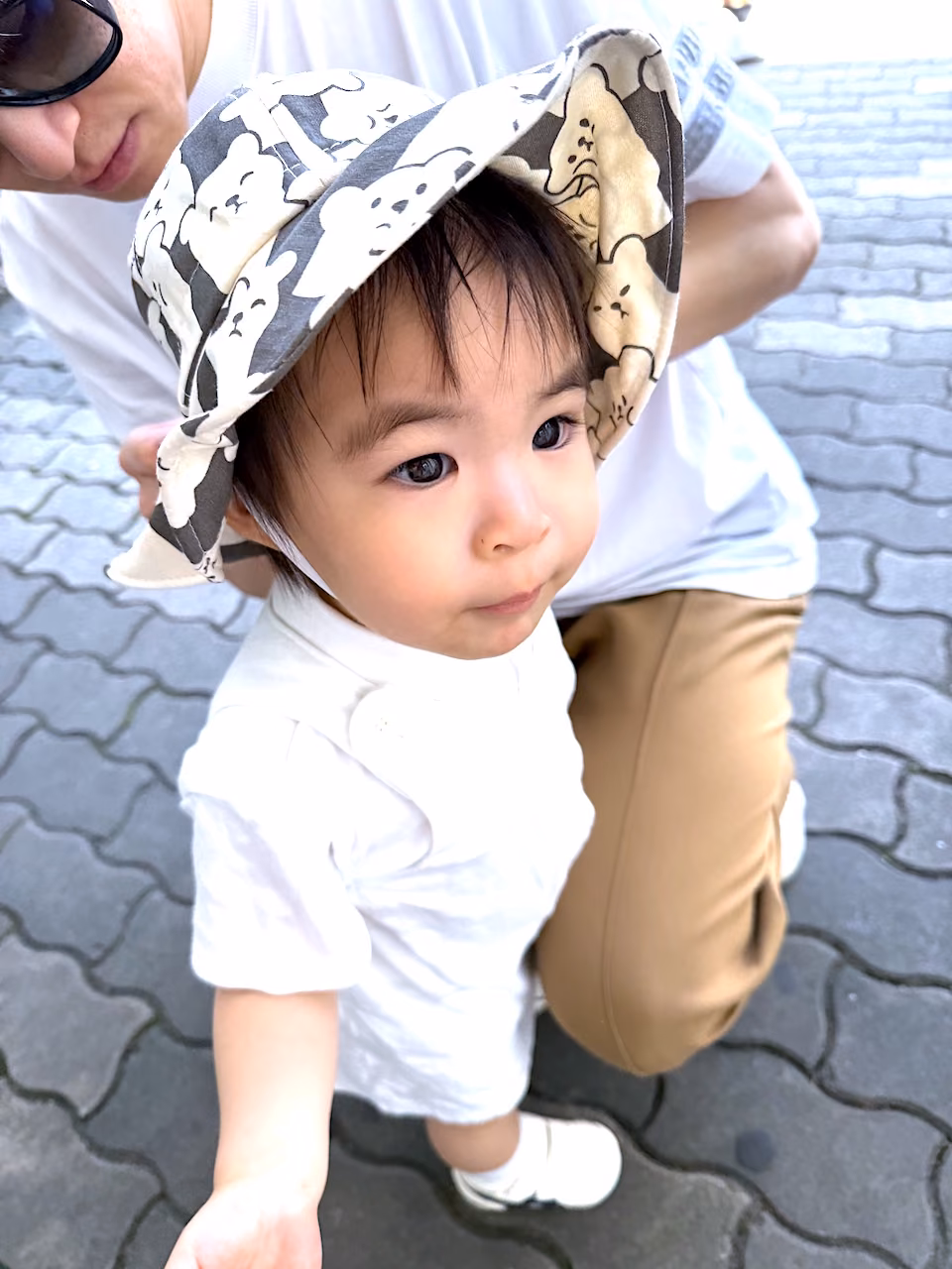 Trying on her new animal-themed hat — ready for more adventures under the sun!